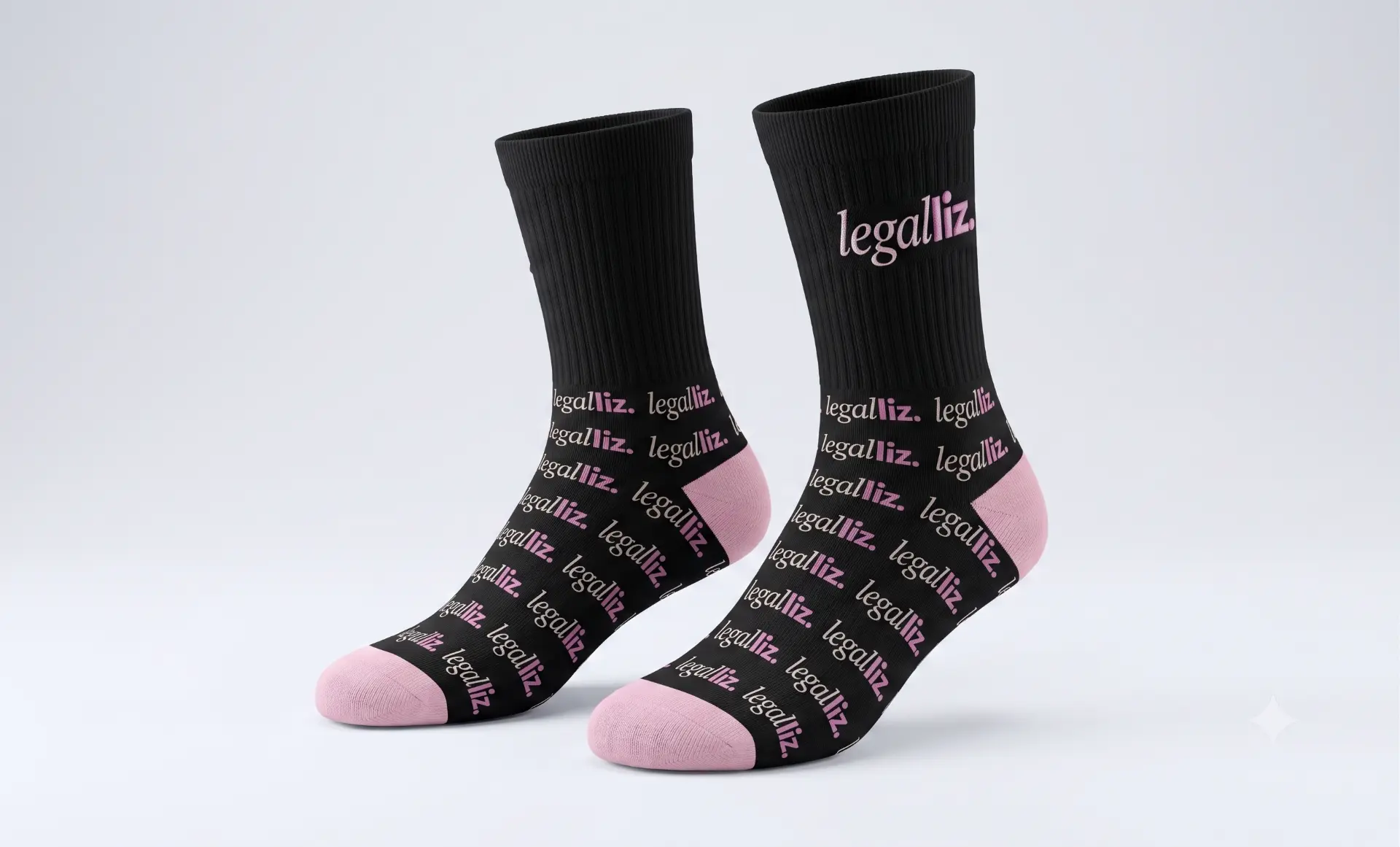 Black crew socks with a repeating LegalLIZ wordmark and pink toe and heel